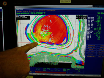 Chief Scientist Dr. John Rooney points out the tracks that have been mapped around Kure Atoll.