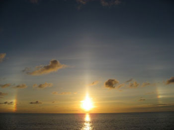 A sunbow, a rainbow without the rain, was the show of the night.  Note the large arc of light around the sun.