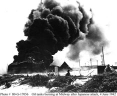 Photo # 80-G-17056  Oil tanks burning at Midway after a Japanese attack, 4, June 1942. Bishop Museum.