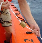 Weight being slid down rope to trigger water collector